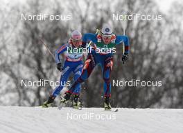26.02.2009, Liberec, Czech Republic (CZE): Celia Bourgois (FRA), Fischer, Rottefella, One Way, Odlo, behind Evgenia Medvedeva (RUS), Fischer, Rottefella, Swix, adidas  - FIS nordic world ski championships, cross-country, 4x5km women, Liberec (CZE). www.nordicfocus.com. © Hemmersbach/NordicFocus. Every downloaded picture is fee-liable.