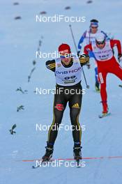 21.11.2009, Beitostoelen, Norway (NOR): Axel Teichmann (GER), Madshus, Rottefella, Swix, adidas, Toko finishes in front of Petter Northug (NOR), Fischer, Rottefella, Alpina, Ski Go, Swix  and Sami Jauhojaervi (FIN), Fischer, Rottefella, Swix - FIS world cup cross country, 15km men, Beitostoelen (NOR). www.nordicfocus.com. © NordicFocus. Every downloaded picture is fee-liable.