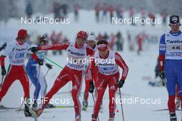22.11.2009, Beitostoelen, Norway (NOR): Remo Fischer (SUI), Fischer, Rottefella, Alpina, KV+, adidas, Dario Cologna (SUI), Fischer, Rottefella, Alpina, Swix, adidas - FIS world cup cross country, 4x10km men, Beitostoelen (NOR). www.nordicfocus.com. © NordicFocus. Every downloaded picture is fee-liable.