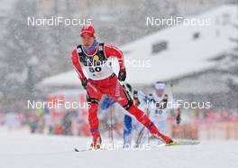 12.12.2009, Davos, Switzerland (SUI): Remo Fischer (SUI), Fischer, Rottefella, Alpina, KV+, adidas  - FIS world cup cross-country, 15km men, Davos (SUI). www.nordicfocus.com. © Hemmersbach/NordicFocus. Every downloaded picture is fee-liable.
