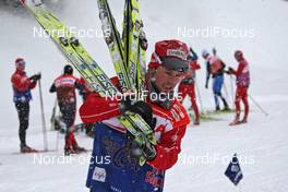 11.12.2009, Davos, Switzerland (SUI): Norwegian ski man carrying skis after testing - FIS world cup cross-country, training, Davos (SUI). www.nordicfocus.com. © Hemmersbach/NordicFocus. Every downloaded picture is fee-liable.