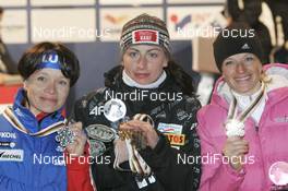 28.02.2009, Liberec, Czech Republic (CZE): winner 30 km mass start l-r: Evgenia Medvedeva (RUS), Fischer, Rottefella, Swix, adidas, Justyna Kowalczyk (POL), Fischer, Salomon, Swix, Valentina Shevchenko (UKR), Fischer, Salomon, Swix - FIS nordic world ski championships, cross country, medals, Liberec (CZE). www.nordicfocus.com. © Furtner/NordicFocus. Every downloaded picture is fee-liable.