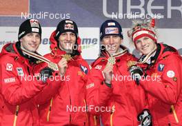 28.02.2009, Liberec, Czech Republic (CZE): Winning team Austria l-r: Wolfgang Loitzl (AUT), Gregor Schlierenzauer (AUT), Martin Koch (AUT), Thomas Morgenstern (AUT), - FIS nordic world ski championships, ski jumping, medals, Liberec (CZE). www.nordicfocus.com. © Furtner/NordicFocus. Every downloaded picture is fee-liable.