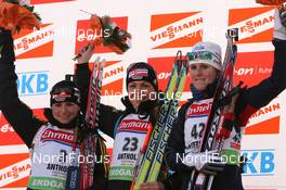 22.01.2010, Antholz, Italy (ITA): (l-r) Andrea Henkel (GER), Atomic, Exel, adidas, Toko, Magdalena Neuner (GER), Fischer, Rottefella, Exel, adidas, Sandrine Bailly (FRA), Madshus, Rottefella, Swix, Odlo - IBU world cup biathlon, sprint women, Antholz (ITA). www.nordicfocus.com. © Manzoni/NordicFocus. Every downloaded picture is fee-liable.