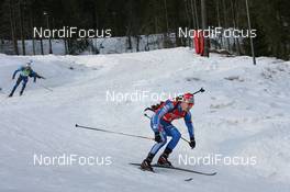 21.03.2010, Holmenkollen, Norway (NOR): Evgeny Ustyugov (RUS), Madshus, Rottefella, Swix, adidas and Simon Fourcade (FRA), Fischer, Rottefella, Swix, Odlo - IBU world cup biathlon, mass men, Holmenkollen (NOR). www.nordicfocus.com. © Manzoni/NordicFocus. Every downloaded picture is fee-liable.