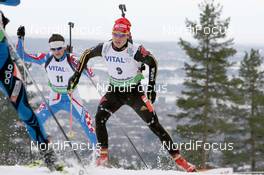 20.03.2010, Holmenkollen, Norway (NOR): Simon Schempp (GER), Fischer, Rottefella, Alpina, Leki, adidas  fights with Jakov Fak (CRO), Fischer, Rottefella, Alpina, Exel - IBU world cup biathlon, pursuit men, Holmenkollen (NOR). www.nordicfocus.com. © Manzoni/NordicFocus. Every downloaded picture is fee-liable.