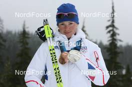 25.02.2010, Whistler, Canada (CAN): Marie Dorin (FRA), Rossignol, Rottefella, Exel, Odlo - Olympic Winter Games Vancouver 2010, biathlon, medals, Whistler (CAN). www.nordicfocus.com. © NordicFocus. Every downloaded picture is fee-liable.