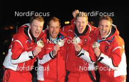 26.02.2010, Whistler, Canada (CAN): l-r: Simon Eder (AUT), Fischer, Rottefella, Daniel Mesotitsch (AUT), Fischer, Rottefella, Dominik Landertinger (AUT), Fischer, Rottefella, Christoph Sumann (AUT), Atomic, Leki  - Olympic Winter Games Vancouver 2010, biathlon, medals, Whistler (CAN). www.nordicfocus.com. © NordicFocus. Every downloaded picture is fee-liable.