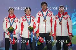 26.02.2010, Whistler, Canada (CAN):  Ivan Tcherezov (RUS), Madshus, Rottefella, Exel, adidas, Maxim Tchoudov (RUS), Fischer, Salomon, adidas Anton Shipulin (RUS), Madshus, Rottefella, adidas, , Evgeny Ustyugov (RUS), Madshus, Swix, adidas - Olympic Winter Games Vancouver 2010, biathlon, medals, Whistler (CAN). www.nordicfocus.com. © NordicFocus. Every downloaded picture is fee-liable.