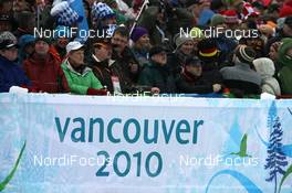 16.02.2010, Whistler, Canada (CAN): Biathlon Feature: Fans over an Olympic banner - Olympic Winter Games Vancouver 2010, biathlon, pursuit women, Whistler (CAN). www.nordicfocus.com. © NordicFocus. Every downloaded picture is fee-liable.