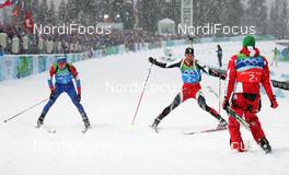 23.02.2010, Whistler, Canada (CAN): l-r: Evgeny Ustyugov (RUS), Madshus, Swix, adidas, Christoph Sumann (AUT), Atomic, Leki, Simon Eder (AUT), Fischer, Rottefella - Olympic Winter Games Vancouver 2010, biathlon, relay men, Whistler (CAN). www.nordicfocus.com. © NordicFocus. Every downloaded picture is fee-liable.