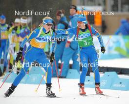23.02.2010, Whistler, Canada (CAN): l-r: Anna Maria Nilsson (SWE), Madshus, Rottefella, adidas, Anna Carin Olofsson (SWE), Madshus, Rottefella, Leki, adidas  - Olympic Winter Games Vancouver 2010, biathlon, relay women, Whistler (CAN). www.nordicfocus.com. © NordicFocus. Every downloaded picture is fee-liable.