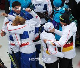 23.02.2010, Whistler, Canada (CAN): Team France and Germany celebrating - Olympic Winter Games Vancouver 2010, biathlon, relay women, Whistler (CAN). www.nordicfocus.com. © NordicFocus. Every downloaded picture is fee-liable.