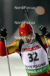 02.12.2010, Oestersund, Sweden (SWE): Chengye Zhang (CHN), Fischer, Salomon, Swix, adidas - IBU world cup biathlon, individual men, Oestersund (SWE). www.nordicfocus.com. © Manzoni/NordicFocus. Every downloaded picture is fee-liable.