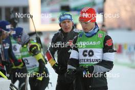 04.12.2010, Oestersund, Sweden (SWE): Simon Schempp (GER), Fischer, Rottefella, Alpina, Leki, adidas  with Andreas Birnbacher (GER), Fischer, Rottefella, Alpina, Leki, adidas - IBU world cup biathlon, sprint men, Oestersund (SWE). www.nordicfocus.com. © Manzoni/NordicFocus. Every downloaded picture is fee-liable.