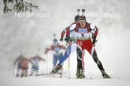 11.12.2010, Hochfilzen, Austria (AUT): Dominik Landertinger (AUT), Fischer, Rottefella, Leki - IBU world cup biathlon, pursuit men, Hochfilzen (AUT). www.nordicfocus.com. © Manzoni/NordicFocus. Every downloaded picture is fee-liable.