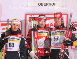 01.01.2010, Oberhof, Germany (GER): podium, l-r: Marcus Hellner (SWE), Fischer, Salomon, Exel, Craft, Petter Northug (NOR), Fischer, Rottefella, Alpina, Ski Go, Swix, Axel Teichmann (GER), Madshus, Rottefella, Swix, adidas, Toko  - FIS world cup cross-country, tour de ski, prologue men, Oberhof (GER). www.nordicfocus.com. © Hemmersbach/NordicFocus. Every downloaded picture is fee-liable.
