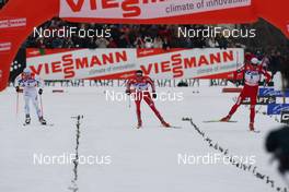 06.01.2010, Cortina-Toblach, Italy (ITA): on the final road: l-r: Marcus Hellner (SWE), Fischer, Salomon, Exel, Craft, Dario Cologna (SUI), Fischer, Rottefella, Alpina, Swix, adidas, Petter Northug (NOR), Fischer, Rottefella, Alpina, Ski Go, Swix   - FIS world cup cross-country, tour de ski, 30km men handicap start, Cortina-Toblach (ITA). www.nordicfocus.com. © Hemmersbach/NordicFocus. Every downloaded picture is fee-liable.