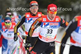 06.01.2010, Cortina-Toblach, Italy (ITA): group, in the focus Rene Sommerfeldt (GER), Madshus, Salomon, Leki, adidas, behind Jens Filbrich (GER), Rossignol, Rottefella, One Way, adidas  - FIS world cup cross-country, tour de ski, 30km men handicap start, Cortina-Toblach (ITA). www.nordicfocus.com. © Hemmersbach/NordicFocus. Every downloaded picture is fee-liable.