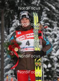 10.01.2010, Val di Fiemme, Italy (ITA): 3rd TdS overall Dario Cologna (SUI), Fischer, Rottefella, Alpina, Swix, adidas  - FIS world cup cross-country, tour de ski, final climb men, Val di Fiemme (ITA). www.nordicfocus.com. © Hemmersbach/NordicFocus. Every downloaded picture is fee-liable.