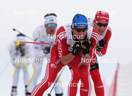 13.03.2010, Holmenkollen, Norway (NOR): group, in front: Curdin Perl (SUI), Rossignol, Rottefella, Leki, adidas, behind Toni Livers (SUI), Madshus, Rottefella, Swix, adidas  - FIS world cup cross-country, 50km men, Holmenkollen (NOR). www.nordicfocus.com. © Hemmersbach/NordicFocus. Every downloaded picture is fee-liable.