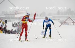21.03.2010, Falun, Sweden (SWE): l-r: Petter Northug (NOR), Fischer, Rottefella, Alpina, Ski Go, Swix , Maurice Manificat (FRA), Fischer, Swix, Odlo  - FIS world cup cross-country, 15km men handicap start, Falun (SWE). www.nordicfocus.com. Â© Felgenhauer/NordicFocus. Every downloaded picture is fee-liable.
