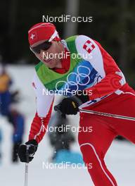 15.02.2010, Whistler, Canada (CAN): Dario Cologna (SUI), Fischer, Rottefella, Alpina, Swix, adidas  - Olympic Winter Games Vancouver 2010, cross-country, 15km men, Whistler (CAN). www.nordicfocus.com. © NordicFocus. Every downloaded picture is fee-liable.