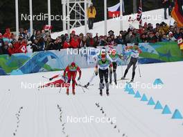 28.02.2010, Whistler, Canada (CAN): While Dario Cologna (SUI), Fischer, Rottefella, Alpina, Swix, adidas falls in the last curve, Petter Northug (NOR), Fischer, Rottefella, Alpina, Ski Go, Swix  and Axel Teichmann (GER), Madshus, Rottefella, Swix, adidas, Toko sprint for the victory - Olympic Winter Games Vancouver 2010, cross-country, mass men, Whistler (CAN). www.nordicfocus.com. © NordicFocus. Every downloaded picture is fee-liable.