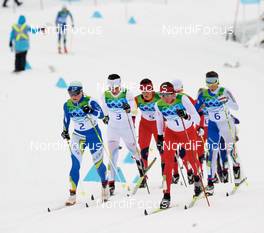 27.02.2010, Whistler, Canada (CAN): l-r: Aino Kaisa Saarinen (FIN), Rossignol, Rottefella, One Way, Charlotte Kalla (SWE), Fischer, Salomon, Swix, Craft, Justyna Kowalczyk (POL), Fischer, Salomon, Swix, Marianna Longa (ITA), Fischer, Salomon, One Way  - Olympic Winter Games Vancouver 2010, cross-country, mass women, Whistler (CAN). www.nordicfocus.com. © NordicFocus. Every downloaded picture is fee-liable.