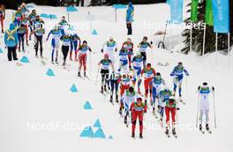 27.02.2010, Whistler, Canada (CAN): l-r: Marit Bjoergen (NOR), Fischer, Rottefella, Swix, Justyna Kowalczyk (POL), Fischer, Salomon, Swix, Charlotte Kalla (SWE), Fischer, Salomon, Swix, Craft leading the top group - Olympic Winter Games Vancouver 2010, cross-country, mass women, Whistler (CAN). www.nordicfocus.com. © NordicFocus. Every downloaded picture is fee-liable.