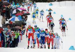 27.02.2010, Whistler, Canada (CAN): l-r: Kristin Stoermer Steira (NOR), Madshus, Salomon, One Way, Swix, Aino Kaisa Saarinen (FIN), Rossignol, Rottefella, One Way, Oxana Jatskaja (KAZ), Fischer, Salomon, Marit Bjoergen (NOR), Fischer, Rottefella, Swix  - Olympic Winter Games Vancouver 2010, cross-country, mass women, Whistler (CAN). www.nordicfocus.com. © NordicFocus. Every downloaded picture is fee-liable.