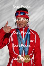 18.02.2010, Whistler, Canada (CAN): medal, Marit Bjoergen (NOR), Fischer, Rottefella, Swix  - Olympic Winter Games Vancouver 2010, cross-country, medals, Whistler (CAN). www.nordicfocus.com. © NordicFocus. Every downloaded picture is fee-liable.