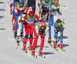 20.02.2010, Whistler, Canada (CAN): group, in front Dario Cologna (SUI), Fischer, Rottefella, Alpina, Swix, adidas, behind Petter Northug (NOR), Fischer, Rottefella, Alpina, Ski Go, Swix   - Olympic Winter Games Vancouver 2010, cross-country, pursuit men, Whistler (CAN). www.nordicfocus.com. © NordicFocus. Every downloaded picture is fee-liable.