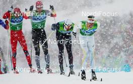 24.02.2010, Whistler, Canada (CAN): Group Johan Olsson (SWE), Madshus, Salomon, Leki, Craft behind  Vincent Vittoz (FRA), Rossignol, Rottefella, One Way, Odlo - Olympic Winter Games Vancouver 2010, cross-country, 4x10km men, Whistler (CAN). www.nordicfocus.com. © NordicFocus. Every downloaded picture is fee-liable.