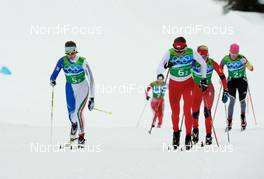 25.02.2010, Whistler, Canada (CAN): l-r: Marianna Longa (ITA), Fischer, Salomon, One Way, Justyna Kowalczyk (POL), Fischer, Salomon, Swix  - Olympic Winter Games Vancouver 2010, cross-country, 4x5km women, Whistler (CAN). www.nordicfocus.com. © NordicFocus. Every downloaded picture is fee-liable.