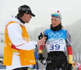 11.02.2010, Whistler, Canada (CAN): Jochen Behle (GER), headcoach cross-country and Claudia Nystad (GER), Atomic, Leki, adidas, Toko discussing - Olympic Winter Games Vancouver 2010, cross-country, training, Whistler (CAN). www.nordicfocus.com. © NordicFocus. Every downloaded picture is fee-liable.