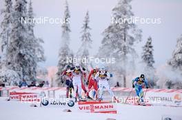 28.11.2010, Kuusamo, Finland (FIN): A group of athletes passing Kuusamo skiing stadium - FIS world cup cross-country, 15km men handicap start, Kuusamo (FIN). www.nordicfocus.com. Â© Felgenhauer/NordicFocus. Every downloaded picture is fee-liable.