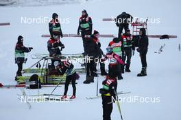 27.11.2010, Kuusamo, Finland (FIN): waxing team  at work - FIS world cup cross-country, 5km women, Kuusamo (FIN). www.nordicfocus.com. © Laiho/NordicFocus. Every downloaded picture is fee-liable.