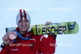 18.02.2010, Whistler, Canada (CAN): medal, Gregor Schlierenzauer (AUT), Fischer - Olympic Winter Games Vancouver 2010, ski jumping, medals, Whistler (CAN). www.nordicfocus.com. © NordicFocus. Every downloaded picture is fee-liable.