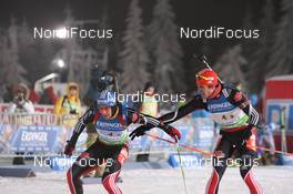 05.01.2011, Oberhof, Germany (GER): Biathlon Feature: Handover between Michael Greis (GER), Madshus, Rottefella, OneWay, adidas and Arnd Peiffer (GER), Fischer, Salomon, Swix, adidas - IBU world cup biathlon, relay men, Oberhof (GER). www.nordicfocus.com. © Manzoni/NordicFocus. Every downloaded picture is fee-liable.