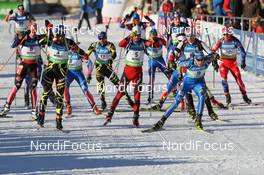 22.01.2011, Antholz, Italy (ITA): Biathlon Feature: Start of the race with Arnd Peiffer (GER), Fischer, Salomon, Swix, adidas, Martin Fourcade (FRA), Rossignol, Rottefella, OneWay, Odlo, Ole Einar Bjoerndalen (NOR), Madshus, Rottefella, Odlo, Bjoern Ferry (SWE), Fischer, Rottefella, Leki, adidas - IBU world cup biathlon, mass men, Antholz (ITA). www.nordicfocus.com. © Manzoni/NordicFocus. Every downloaded picture is fee-liable.