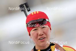 21.01.2011, Antholz, Italy (ITA): Xue Dong (CHN), Fischer, Salomon, Swix, adidas - IBU world cup biathlon, sprint women, Antholz (ITA). www.nordicfocus.com. © Manzoni/NordicFocus. Every downloaded picture is fee-liable.