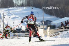 05.02.2011, Presque Isle, United States of America (USA): Magdalena Neuner (GER), Fischer, Rottefella, Exel, adidas and Sofie Boilley (FRA), Rossignol, Rottefella, OneWay - IBU world cup biathlon, relay mixed, Presque Isle (USA). www.nordicfocus.com. © Manzoni/NordicFocus. Every downloaded picture is fee-liable.