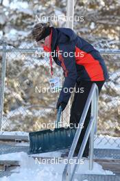 03.02.2011, Presque Isle, United States of America (USA): Biathlon Feature: Volunteer cleans the grand stand - IBU world cup biathlon, training, Presque Isle (USA). www.nordicfocus.com. © Manzoni/NordicFocus. Every downloaded picture is fee-liable.