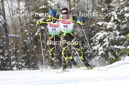 10.02.2011, Fort Kent, United States of America (USA): Simon Fourcade (FRA), Fischer, Rottefella, Rossignol, Swix, Odlo and Vincent Jay (FRA), Fischer, Rottefella, OneWay - IBU world cup biathlon, sprint men, Fort Kent (USA). www.nordicfocus.com. © Manzoni/NordicFocus. Every downloaded picture is fee-liable.