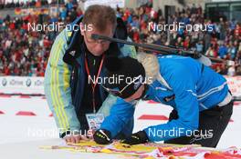 20.03.2011, Holmenkollen, Norway (NOR): Rudi Lorenz (GER), IBU Anti Doping and Logistics Assistent and Kaisa Maekaeraeinen (FIN), Fischer, Rottefella, Leki, Odlo - IBU world cup biathlon, training, Holmenkollen (NOR). www.nordicfocus.com. © Manzoni/NordicFocus. Every downloaded picture is fee-liable.