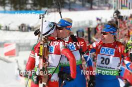 20.03.2011, Holmenkollen, Norway (NOR): Darya Domracheva (BLR), Fischer, Rottefella, Swix, Olga Zaitseva (RUS), Madshus, Rottefella, Alpina, Swix, adidas, Anna Bogaly-Titovets (RUS), Fischer, Rottefella, Alpina, OneWay, adidas - IBU world cup biathlon, mass women, Holmenkollen (NOR). www.nordicfocus.com. © Manzoni/NordicFocus. Every downloaded picture is fee-liable.