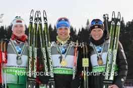 12.03.2011, Khanty-Mansiysk, Russia (RUS): (L-R): Darya Domracheva (BLR), Fischer, Rottefella, Swix, Magdalena Neuner (GER), Fischer, Rottefella, Exel, adidas, Tora Berger (NOR), Fischer, Rottefella, Odlo - IBU world championships biathlon, medals, Khanty-Mansiysk (RUS). www.nordicfocus.com. © Manzoni/NordicFocus. Every downloaded picture is fee-liable.