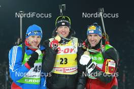 08.03.2011, Khanty-Mansiysk, Russia (RUS): (L-R): Maxim Maksimov (RUS), Madshus, Rottefella, Swix, adidas, Tarjei Boe (NOR), Fischer, Rottefella, Swix, ODLO, Christoph Sumann (AUT), Atomic, Leki  - IBU world championships biathlon, medals, Khanty-Mansiysk (RUS). www.nordicfocus.com. © Manzoni/NordicFocus. Every downloaded picture is fee-liable.