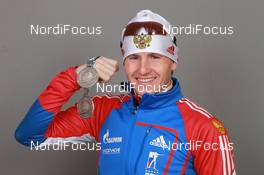 18.03.2011, Khanty-Mansiysk, Russia (RUS): Maxim Maksimov (RUS), Madshus, Rottefella, Swix, adidas - IBU world championships biathlon, medals, Khanty-Mansiysk (RUS). www.nordicfocus.com. © Manzoni/NordicFocus. Every downloaded picture is fee-liable.